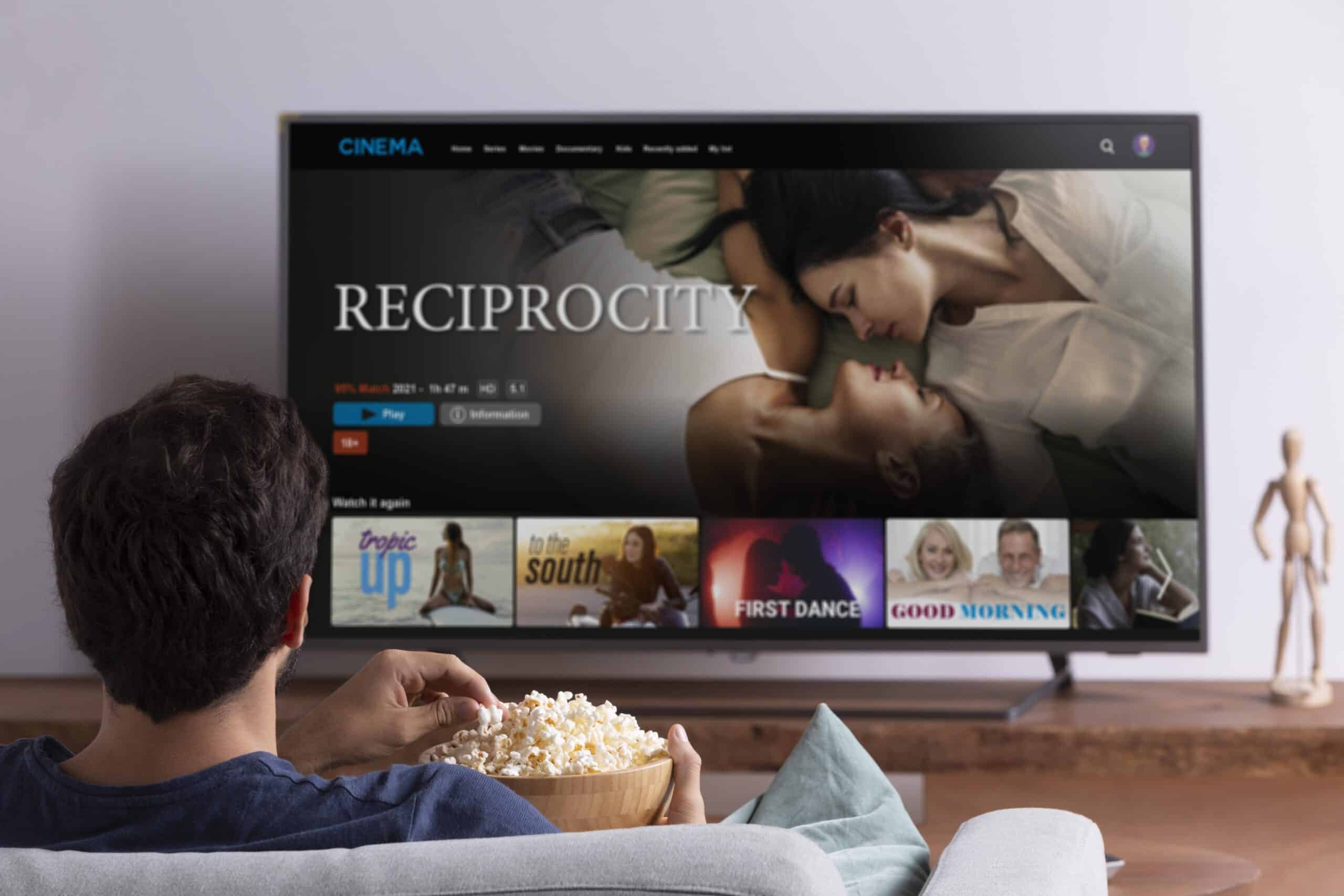 man watching streaming service his tv scaled
