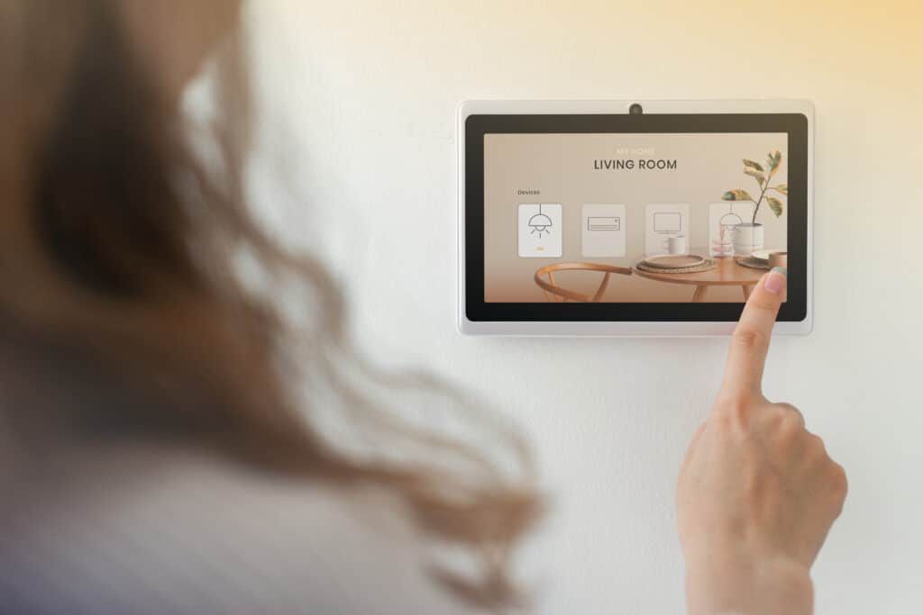 smart home innovation technology with woman using control panel