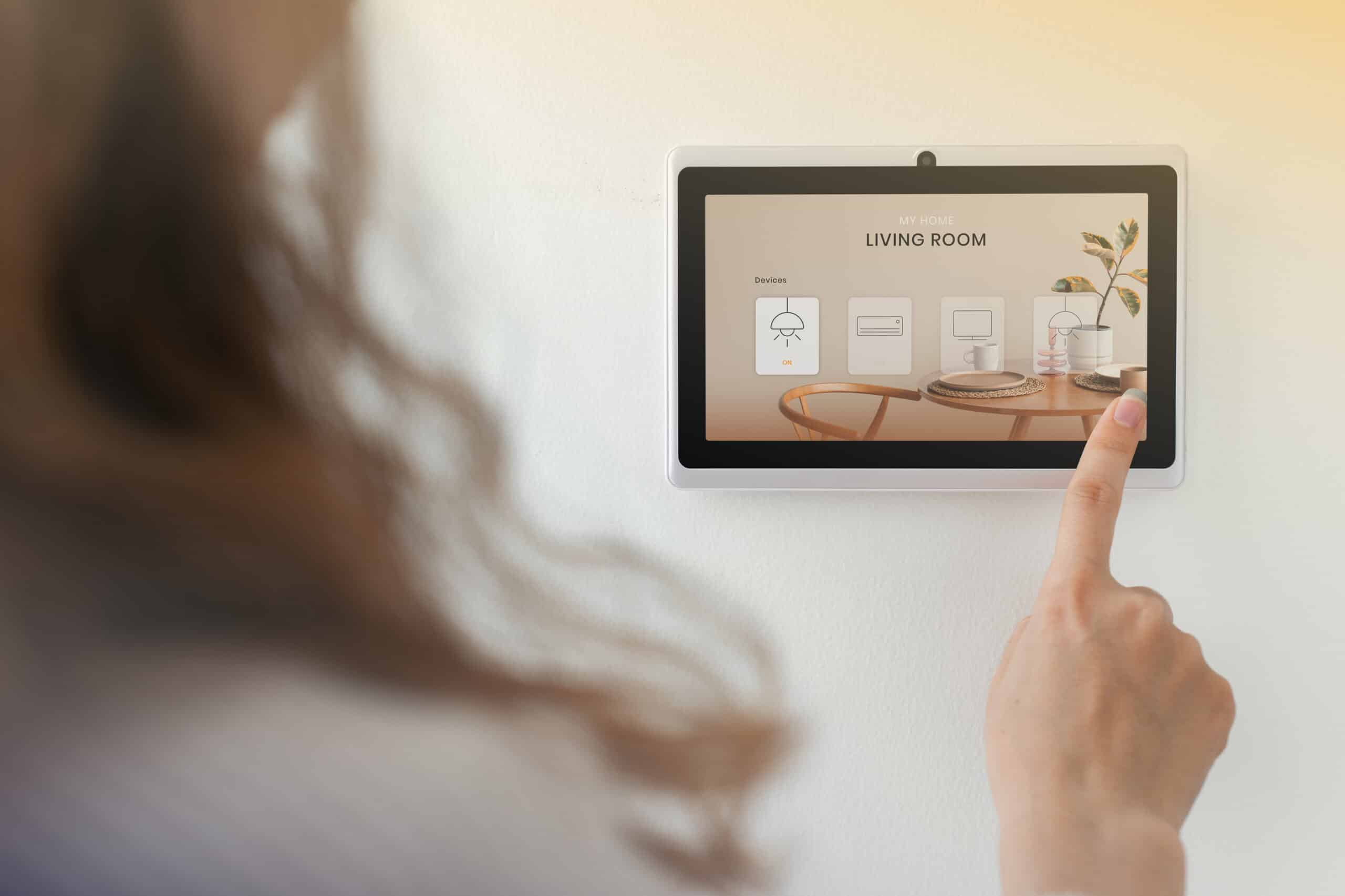 smart home innovation technology with woman using control panel scaled