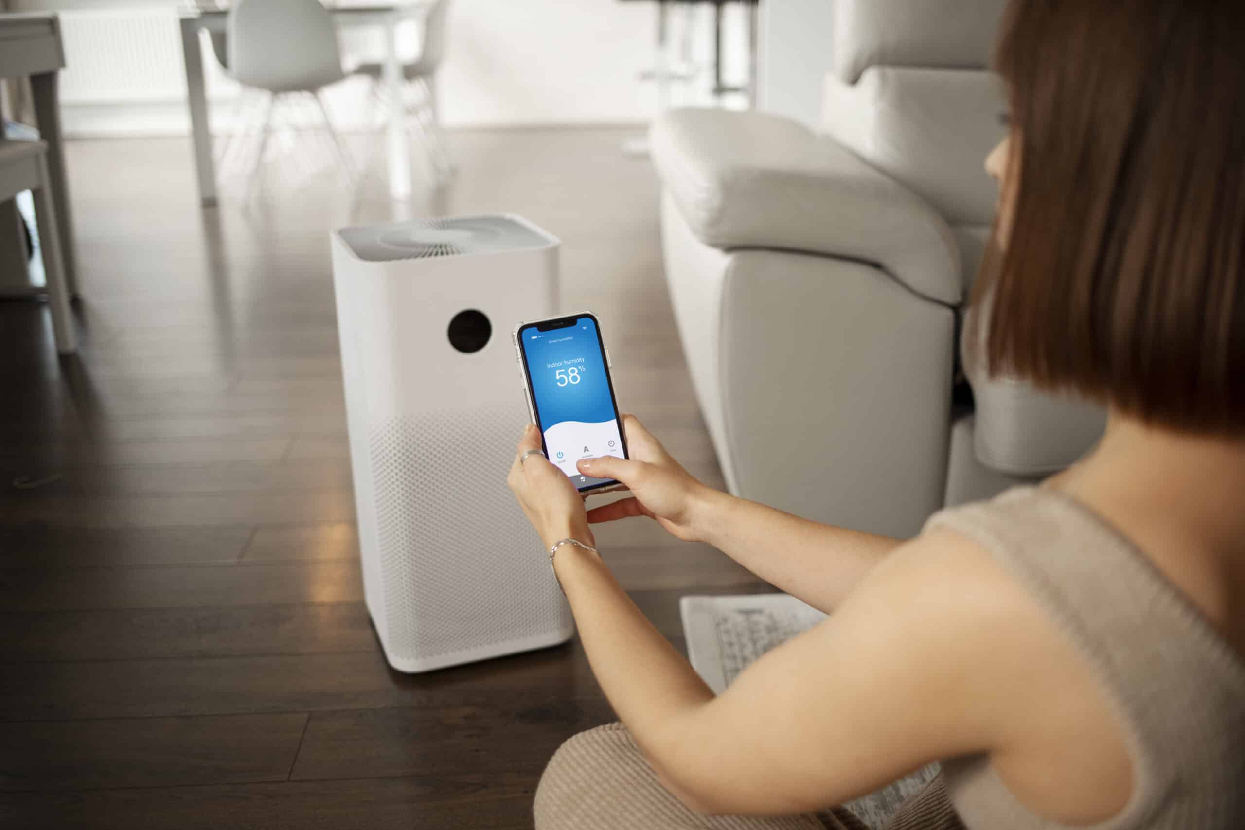 young woman using home technology scaled